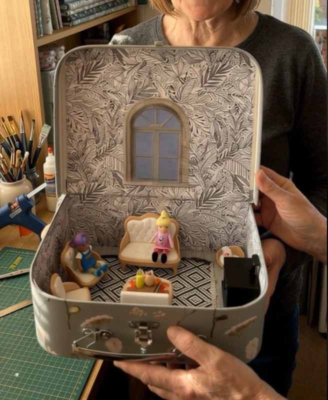 Fairy cosy Lounge scene in a suitcase.
