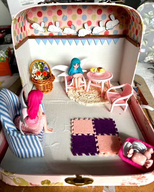 Fairy scene in a suitcase