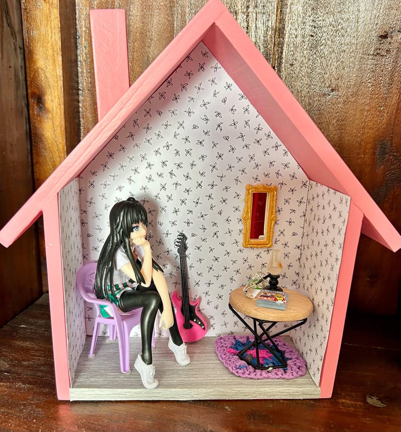scene on a shelf Anime doll sitting casually by fireside or coffee table scene. — photo 6